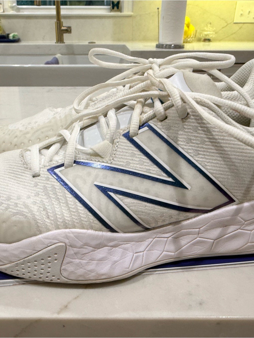 New Balance White Athletic Shoes with Blue Logo Accent